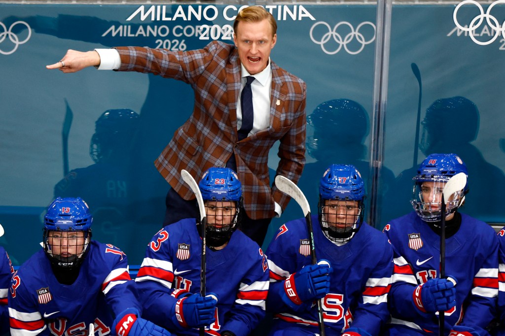 United States head coach John Wroblewski reacts against Italy during the match in a women's ice hockey quarterfinal during the Milano Cortina 2026 Olympic Winter Games at Milano Rho Ice Hockey Arena. 