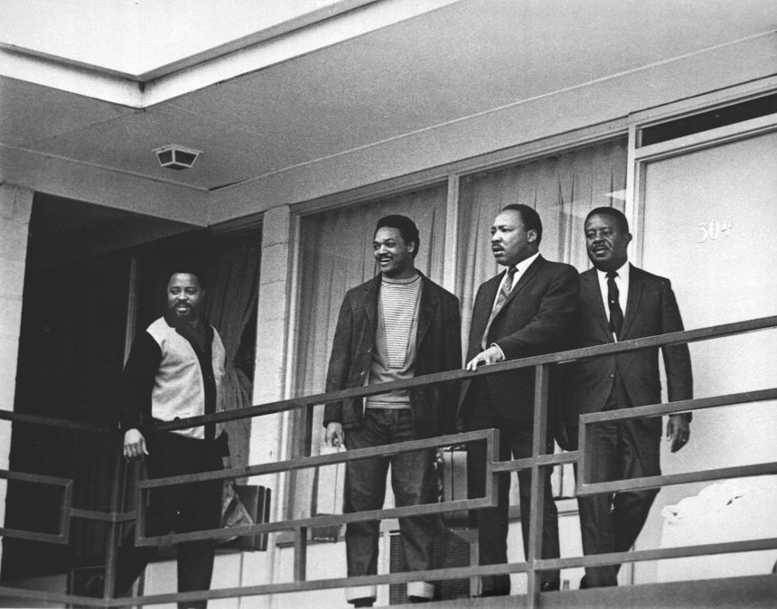 This April 3, 1968 file photo shows Rev. Martin Luther King Jr., second from right, standing with other civil rights leaders on the balcony of the Lorraine Motel in Memphis, Tenn., a day before he was assassinated at approximately the same place. From left are Hosea Williams, Jesse Jackson, King, and Ralph Abernathy. Today's protests across America against racial injustice are being watched closely by people who five decades ago faced jail cells, bloody assaults, snarling dogs and even potential assassination in the battle against institutional racism.  (AP Photo/Charles Kelly, File)