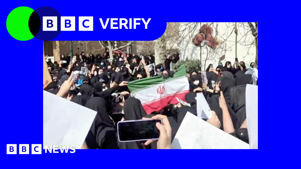 Promo Verify image showing students at Tehran's al-Zahra University set the flag of the Islamic Republic on fire