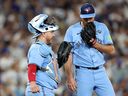 Alejandro Kirk #30 and Trey Yesavage #39 of the Toronto Blue Jays meet at the mound during the fourth inning against the Los Angeles Dodgers in game five of the 2025 World Series at Dodger Stadium on October 29, 2025 in Los Angeles.