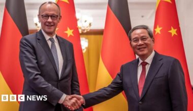 Friedrich Merz and Premier of China Li Qiang shake hands at the Great Hall of the People in Beijing