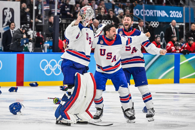 USA hockey players celebrate on the ice