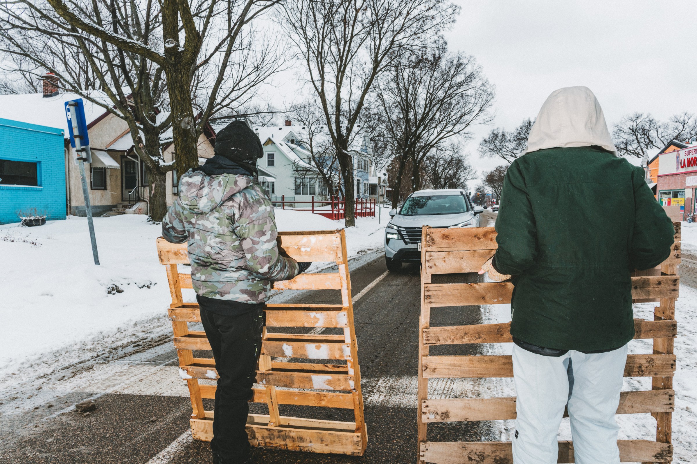 Anti-ICE road blocks and observer checkpoints set up to stop cars and run plates for suspected ICE vehicles