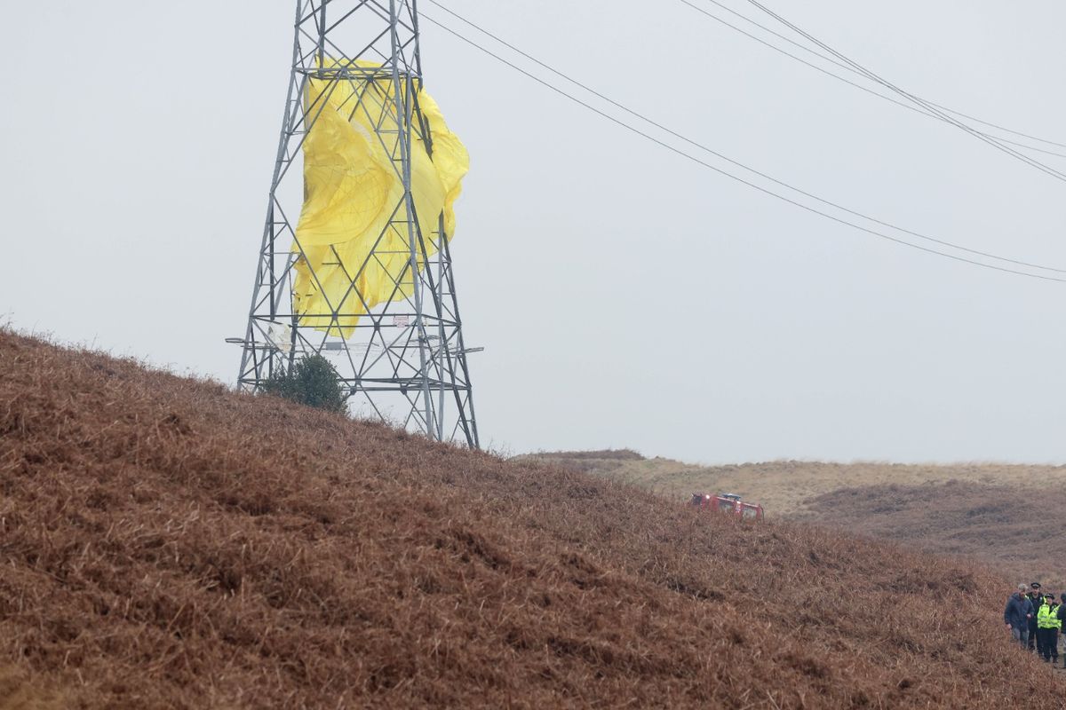 Police at the scene of the crash on moorland near Littleborough 
