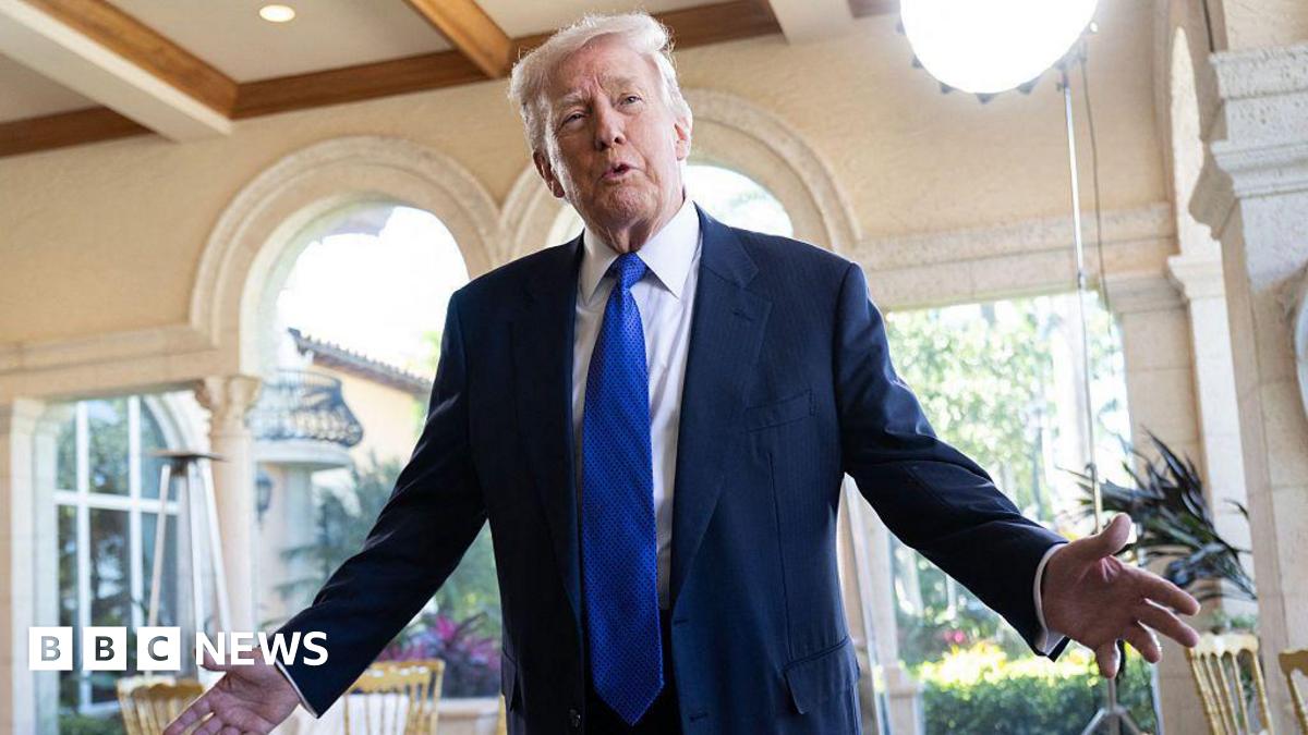 Donald Trump wearing blue suit and tie.