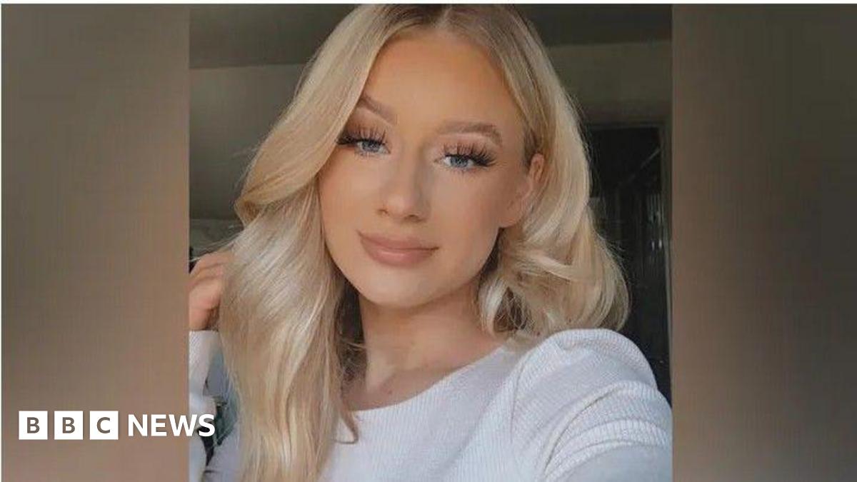 Lucy Harrison, who has long blonde hair resting on top of her head, smiles at the camera