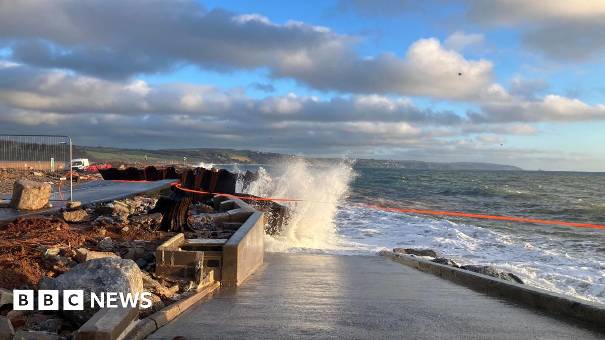 A wave crashes into the partially collapsed A379 Slapton Line between Torcross and Slapton.