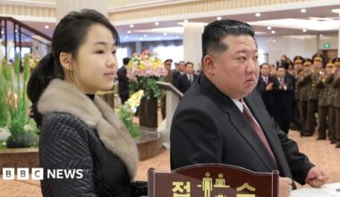 A photo released by the official Korean Central News Agency (KCNA) shows North Korean leader Kim Jong Un (C), accompanied by his daughter Kim Ju Ae (R), overseeing a test-fire of a large-caliber multiple-rocket launcher system at an unknown location in North Korea, 27 January 2026