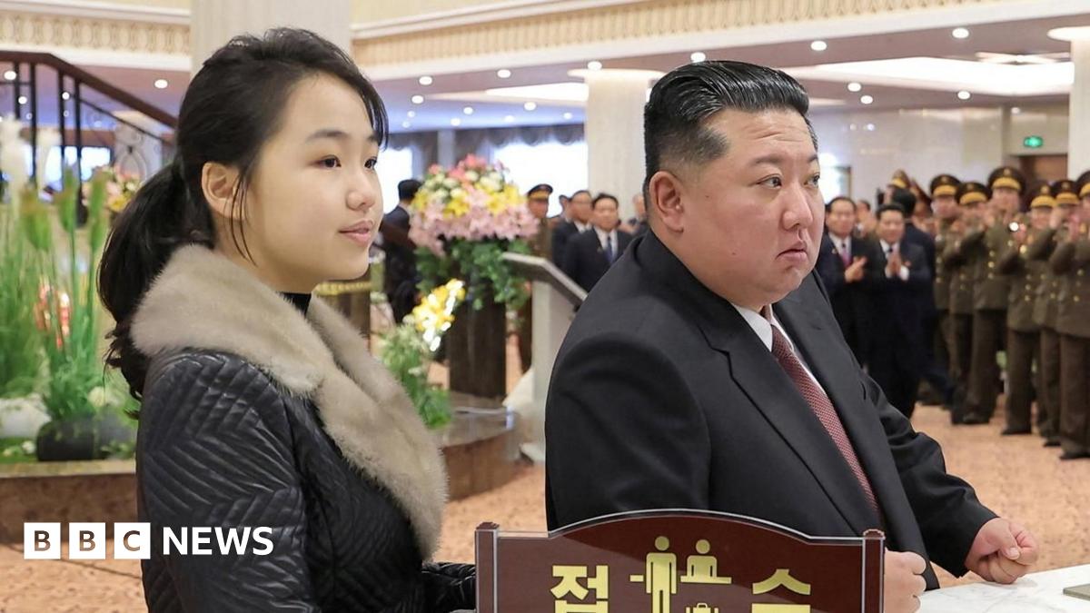 A photo released by the official Korean Central News Agency (KCNA) shows North Korean leader Kim Jong Un (C), accompanied by his daughter Kim Ju Ae (R), overseeing a test-fire of a large-caliber multiple-rocket launcher system at an unknown location in North Korea, 27 January 2026
