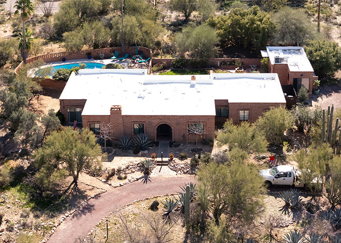 Aerial view of a desert home surrounded by trees and shrubs related to Nancy Guthrie disappearance investigation. Aerial view of a desert home surrounded by trees and shrubs related to Nancy Guthrie disappearance investigation.