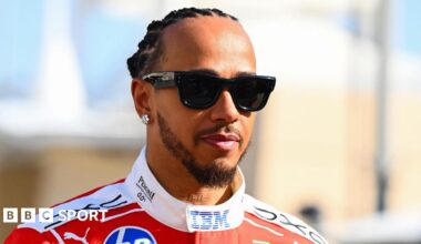 Lewis Hamilton pictured wearing sunglasses in his Ferrari race overall at the Bahrain pre-season test