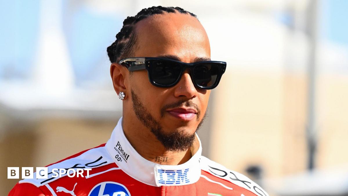 Lewis Hamilton pictured wearing sunglasses in his Ferrari race overall at the Bahrain pre-season test
