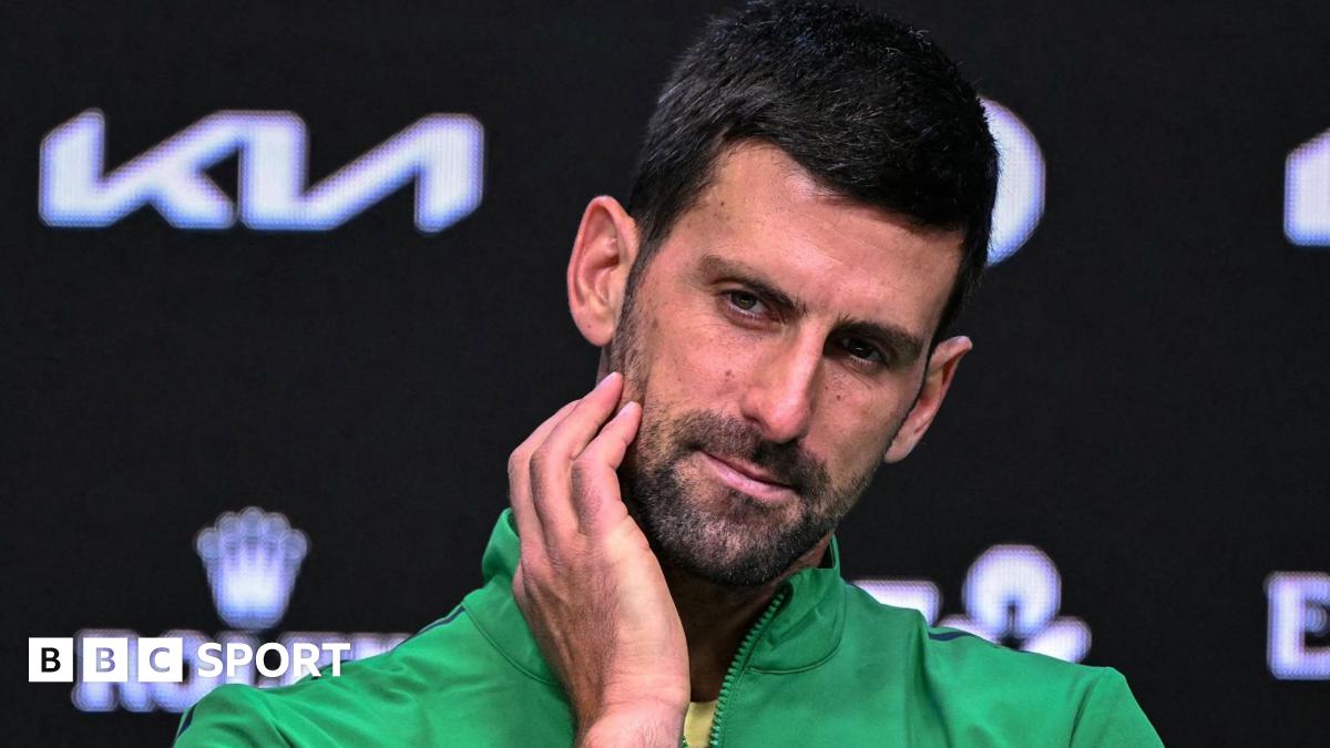 Novak Djokovic reacts in his Australian Open news conference