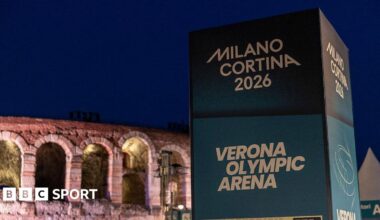 A sign for the Milano Cortina Games in front of Verona Arena - an historic stone-build venue.
