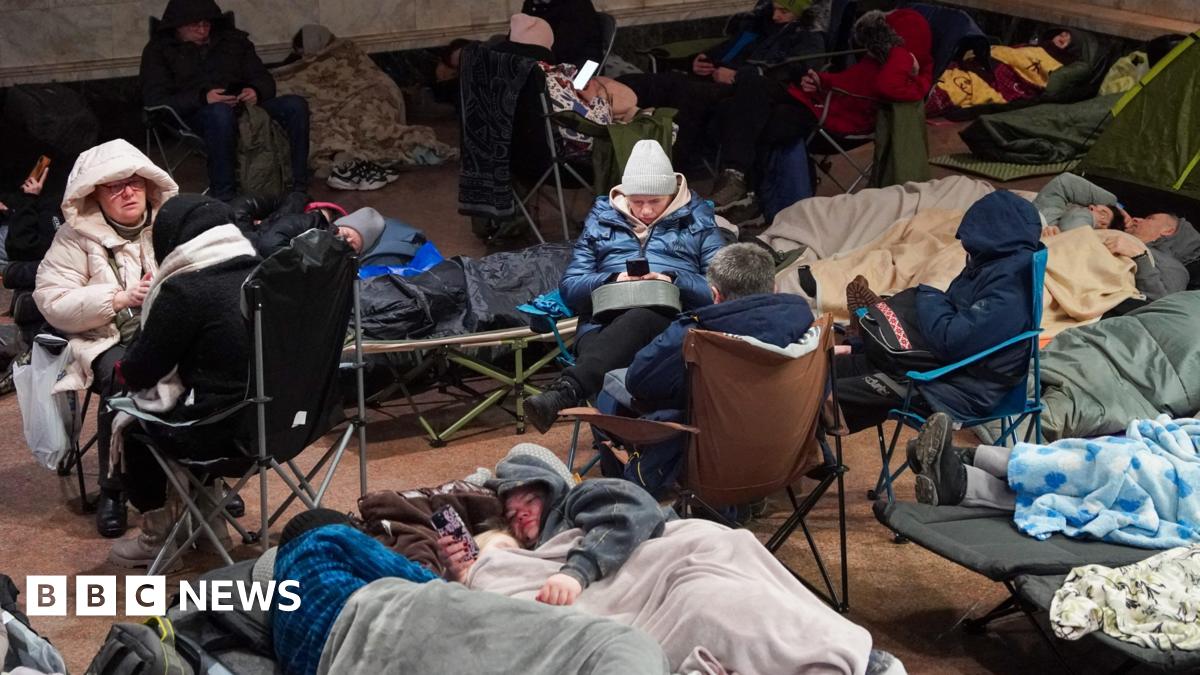 People take shelter at a metro station during a Russian air attack, in Kyiv, on early February 3, 2026.