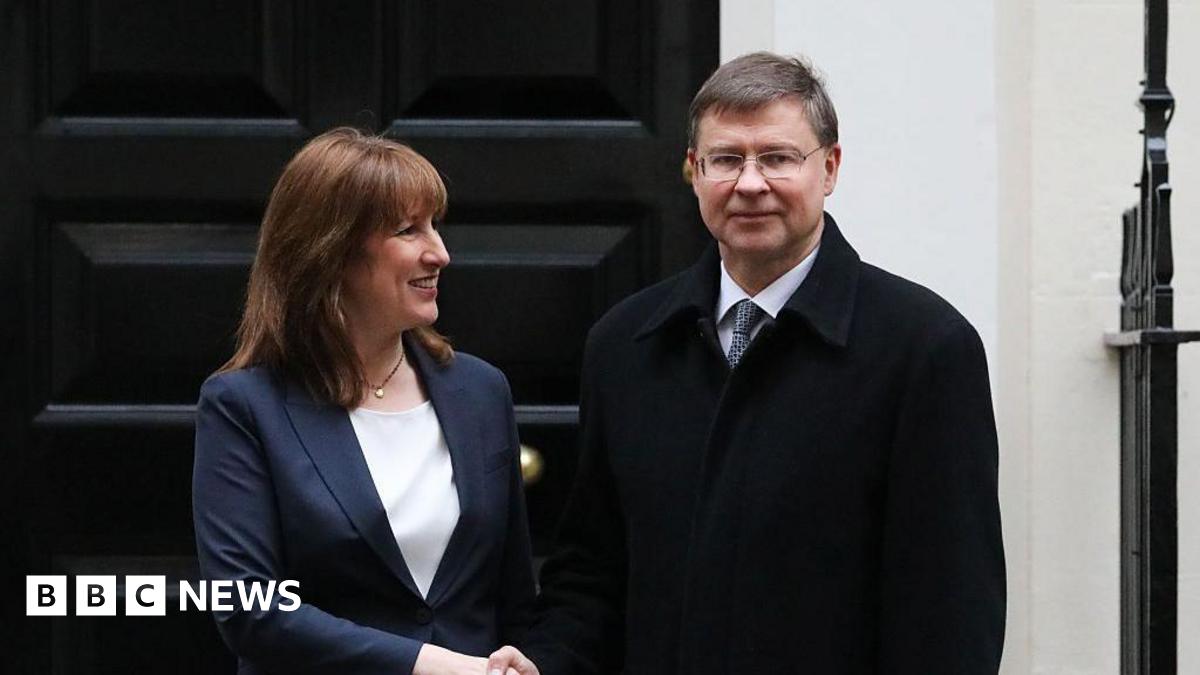 Chancellor Rachel Reeves grins as she shakes hands with European Commissioner for Finance Valdis Dombrovskis outside 11 Downing Street.