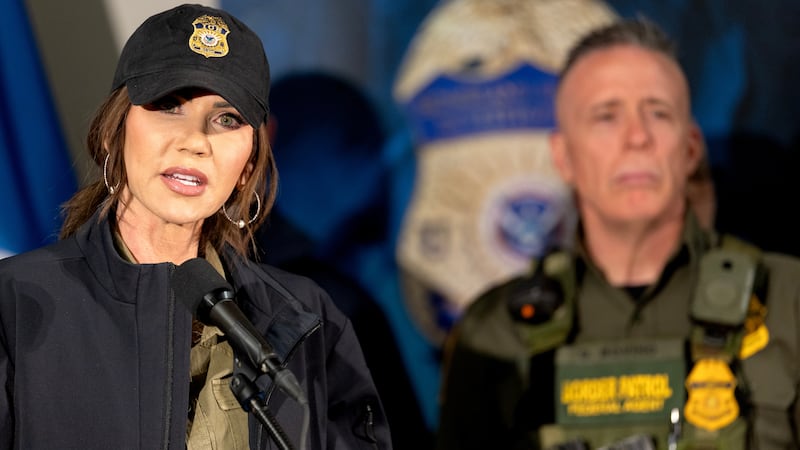 Secretary of Homeland Security Kristi Noem during a press conference at the Bishop Henry Whipple Federal Building in Minneapolis, Minn., on Wednesday, January 7, 2026. Behind Noem is Border Patrol official, Gregory Bovino.