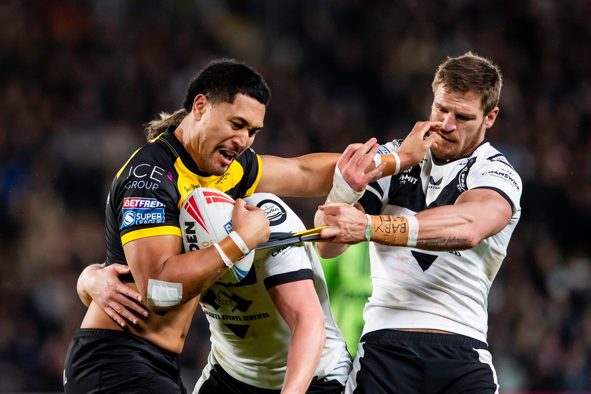 York's Toa Mata'ata is tackled by Hull FC's Jed Cartwright.