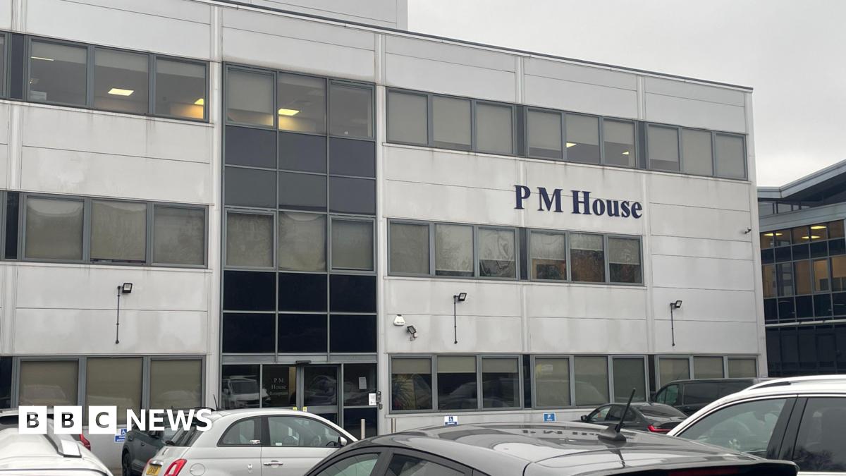 A sheet of white paper taped to the inside of a glass door or window. The notice is printed in large text at the top with the heading “IMPORTANT NOTICE”, followed by smaller text explaining that, due to regulatory matters, the businesses operating from the building can no longer trade. The sign also provides an email address for staff from PM Law and associated businesses to contact.