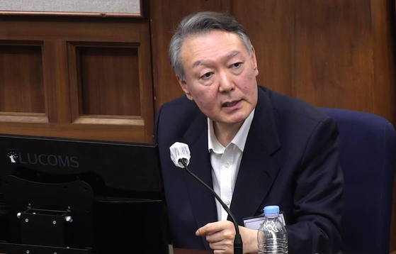 Former President Yoon Suk Yeol speaks at a hearing of his trial on insurrection charges at the Seoul Central District Court in Seocho District, southern Seoul, on Dec. 29, 2025. [YONHAP]