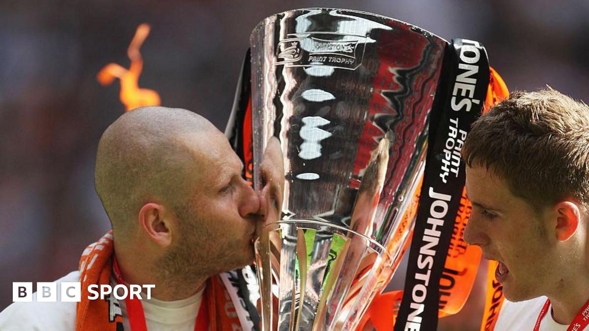 Kevin Nicholls of Luton Town kisses the trophy after victory in the Johnstone's Paint Trophy Final match between Luton Town and Scunthorpe United at Wembley Stadium in 2009