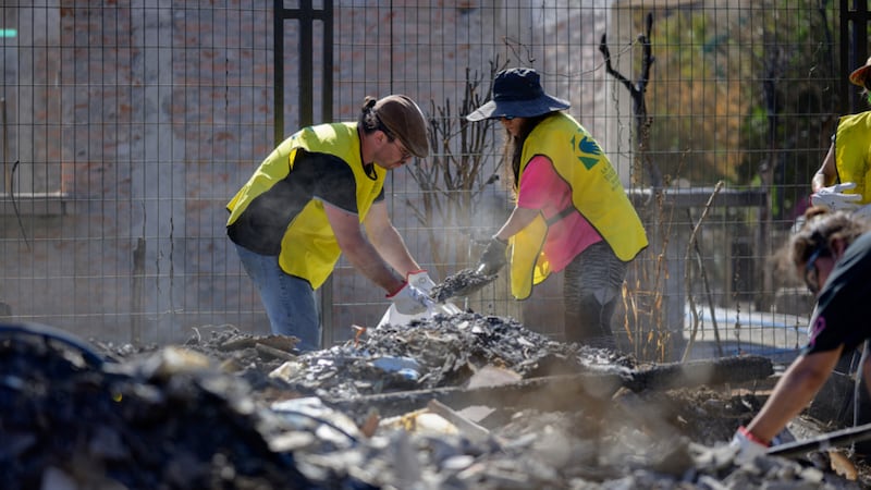 Members of The Church of Jesus Christ of Latter-day Saints help clean up after wildfires in the Biobío region, southern Chile, on Saturday, Jan. 24, 2026.