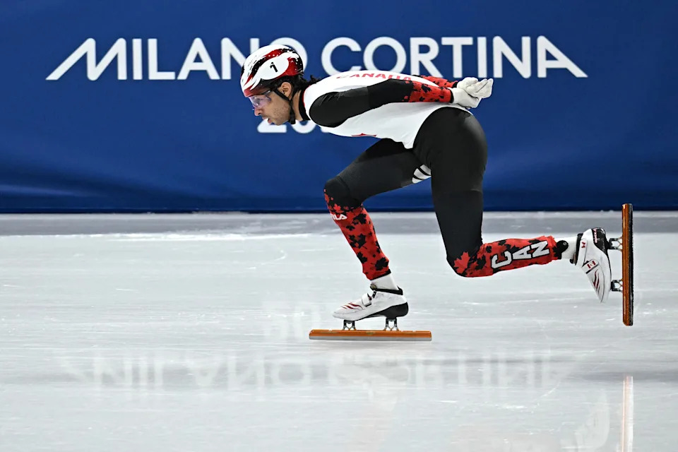 Canada's William Dandjinou competes in the short track speed skating men's 1500m semi-final during the Milano Cortina 2026 Winter Olympic Games at Milano Ice Skating Arena in Milan on February 14, 2026. (Photo by Gabriel BOUYS / AFP via Getty Images)