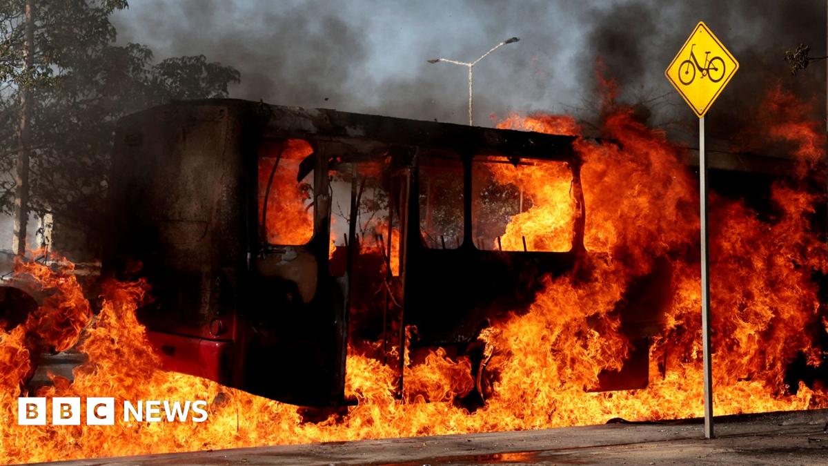 A recruitment poster in the Russian town of Yelets promises big sums of money for anyone who joins up. It shows a man in uniform pointing a rifle to the right