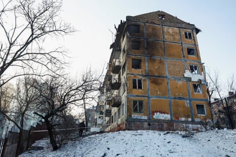A police officer walks at the site of an apartment building hit by a Russian drone strike in Kyiv on 3 February 2026.