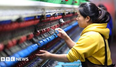 An employee operates a machine at a silk production enterprise on November 17, 2025 in Chongqing, China