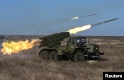 Russian soldiers fire a BM-21 Grad multiple rocket launcher system during military exercises in 2019, three years before the Ukraine invasion.