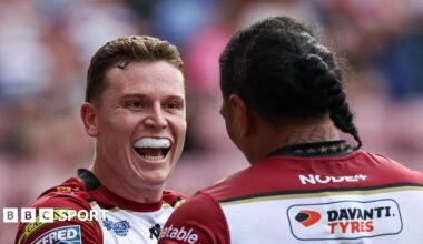 Wigan Warriors' Jai Field celebrates with Patrick Mago after scoring a try.