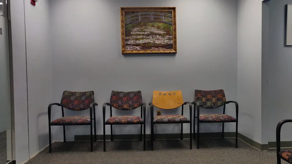 A doctor’s office waiting room. The kind of place where costs start piling up fast. Credit: Kurt Kaiser via Wikimedia Commons.