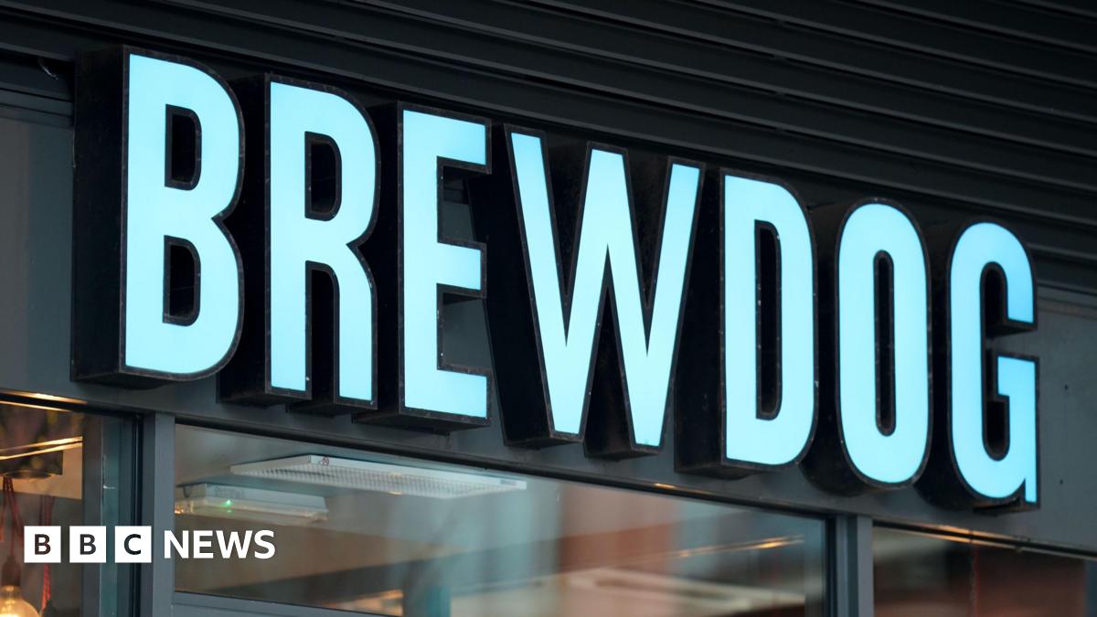A Brewdog sign above a bar in blue lettering.