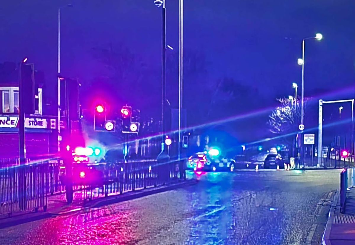 Walton Hall Avenue has been closed by police following a crash