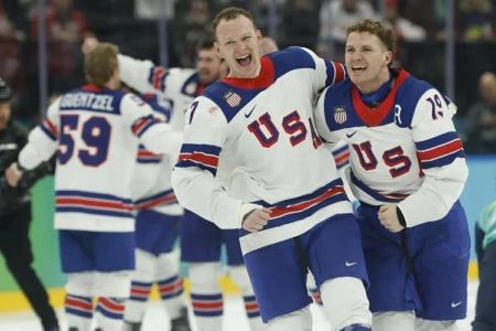Feb 22, 2026; Milan, Italy; Brady Tkachuk #7 of Team United States and Matthew Tkachuk #19 of Team United States celebrate after their game against Team Canada during the Milano Cortina 2026 Olympic Winter Games at Milano Santagiulia Ice Hockey Arena. Mandatory Credit: Geoff Burke-Imagn Images