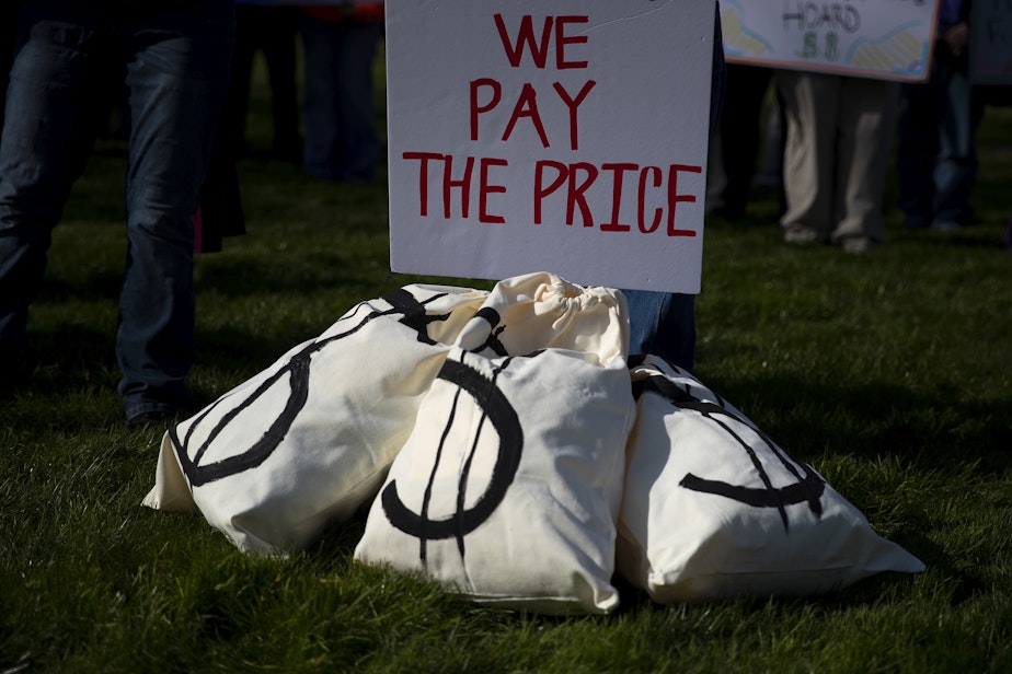 caption: A ‘Corporations get tax breaks, working families pay the price’ rally takes place on Thursday, February 26, 2026, on the Washington State Capitol campus in Olympia.