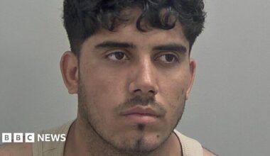 Ahmad Mulakhil wears a light brown vest. He has curly black hair over his forehead and slight black stubble.