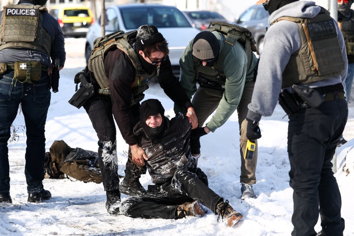 So much for Trump's "softer touch" with ICE operations in Minneosta. Here's a band of masked federal agents detaining a protester in Minneapolis on Feb. 3.