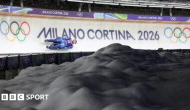 A luge competitor goes down the track in Cortina