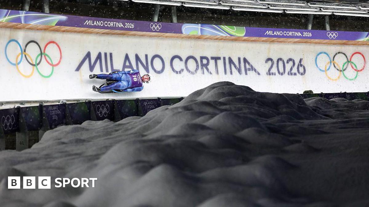 A luge competitor goes down the track in Cortina