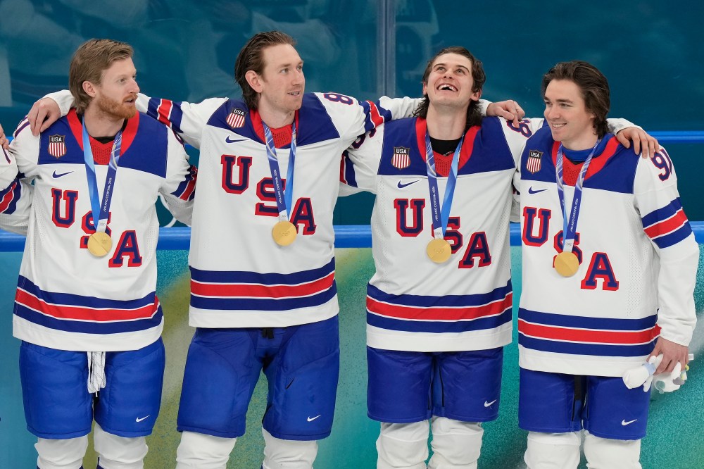 Luca Bruno / THE ASSOCIATED PRESS
Winnipeg Jets forward Kyle Connor, left, celebrates with United States teammates after receiving their gold medals, Sunday. Connor's return to NHL action for the Jets is up in the air at the moment.