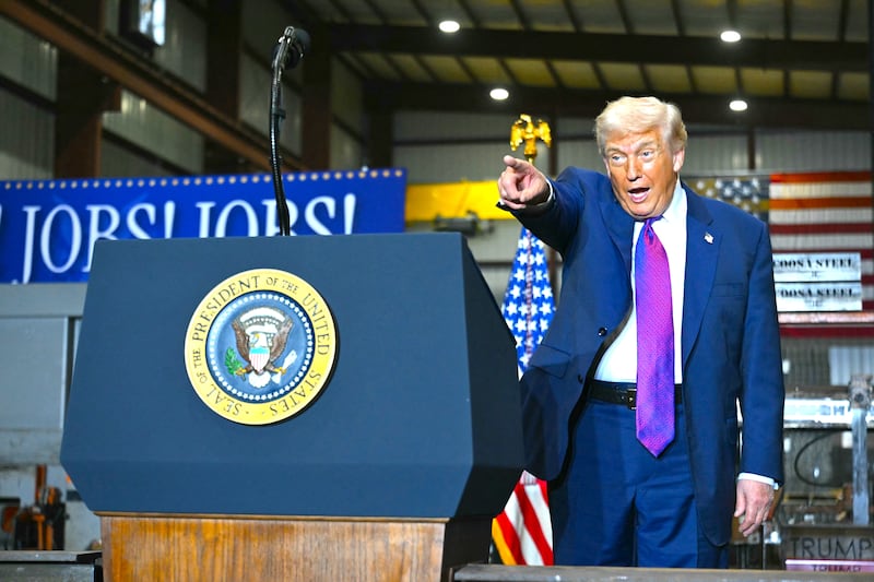 Donald Trump reacts as he's greeted by attendees to his speech about the economy at the Coosa Steel Corporation factory in Rome, Georgia, on February 19, 2026.
