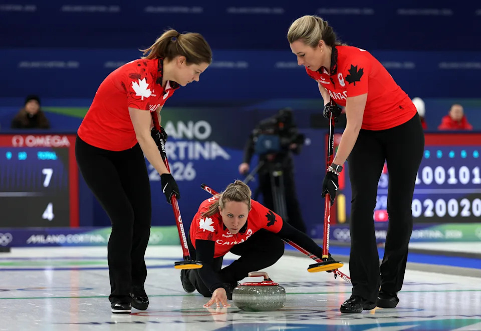 CORTINA D'AMPEZZO, ITALY - FEBRUARY 12: Sarah Wilkes, Rachel Homan and Emma Miskew of Team Canada compete during the Women's Round Robin match between Team Canada and Team Denmark on day six of the Milano Cortina 2026 Winter Olympic games at Cortina Curling Olympic Stadium on February 12, 2026 in Cortina d'Ampezzo, Italy. (Photo by Al Bello/Getty Images)
