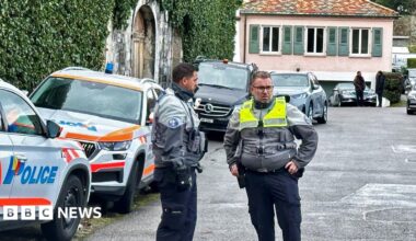 Police officers stand guard outside of the Omani ambassador's residence in Geneva, Switzerland, during indirect nuclear talks between the United States and Iran (17 February 2026)