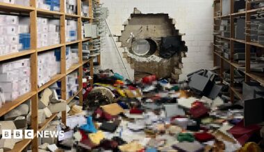 A wall in a bank with a mess on the floor