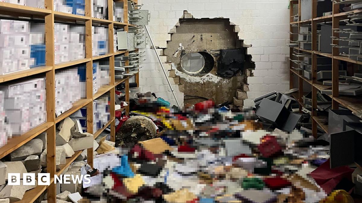 A wall in a bank with a mess on the floor