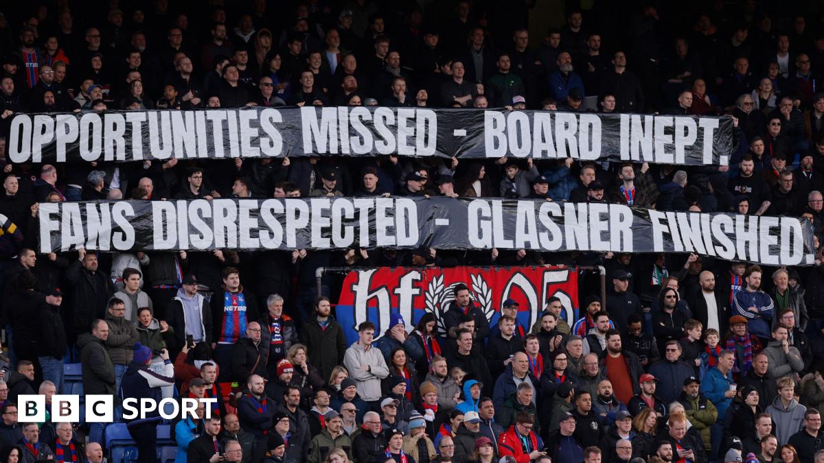 Crystal Palace fans holding banners during their win over Wolves which call the club's board "inept" and say that manager Oliver Glasner is "finished"