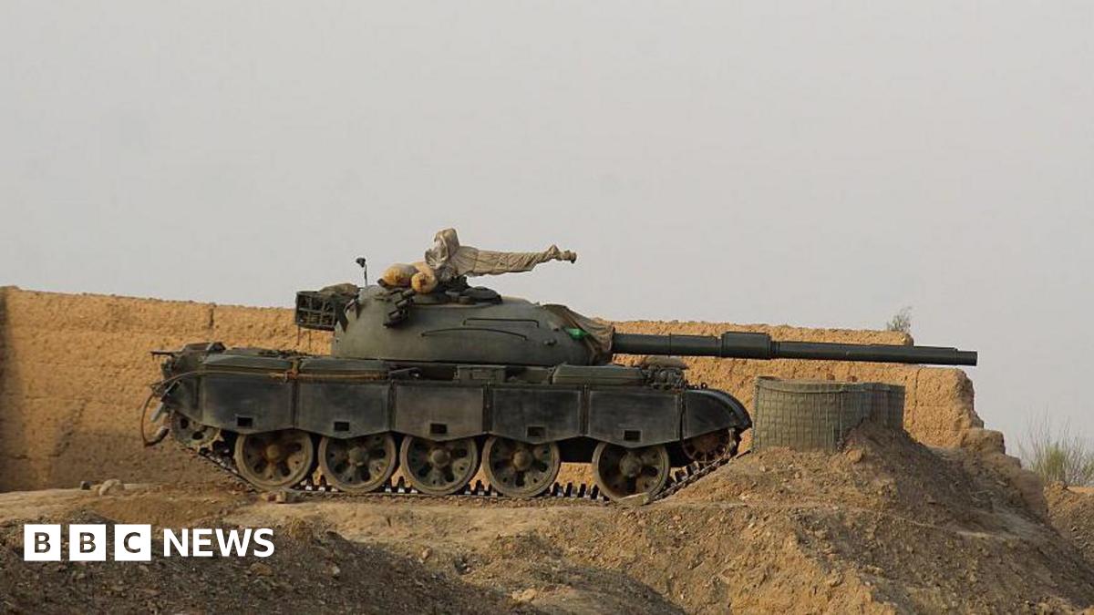 A tank near a wall along the border in Chaman, Pakistan.