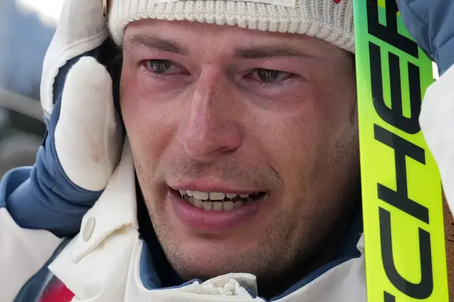 Sturla Holm Laegreid, of Norway, reacts after he won bronze in the men's 20-kilometer individual biathlon race